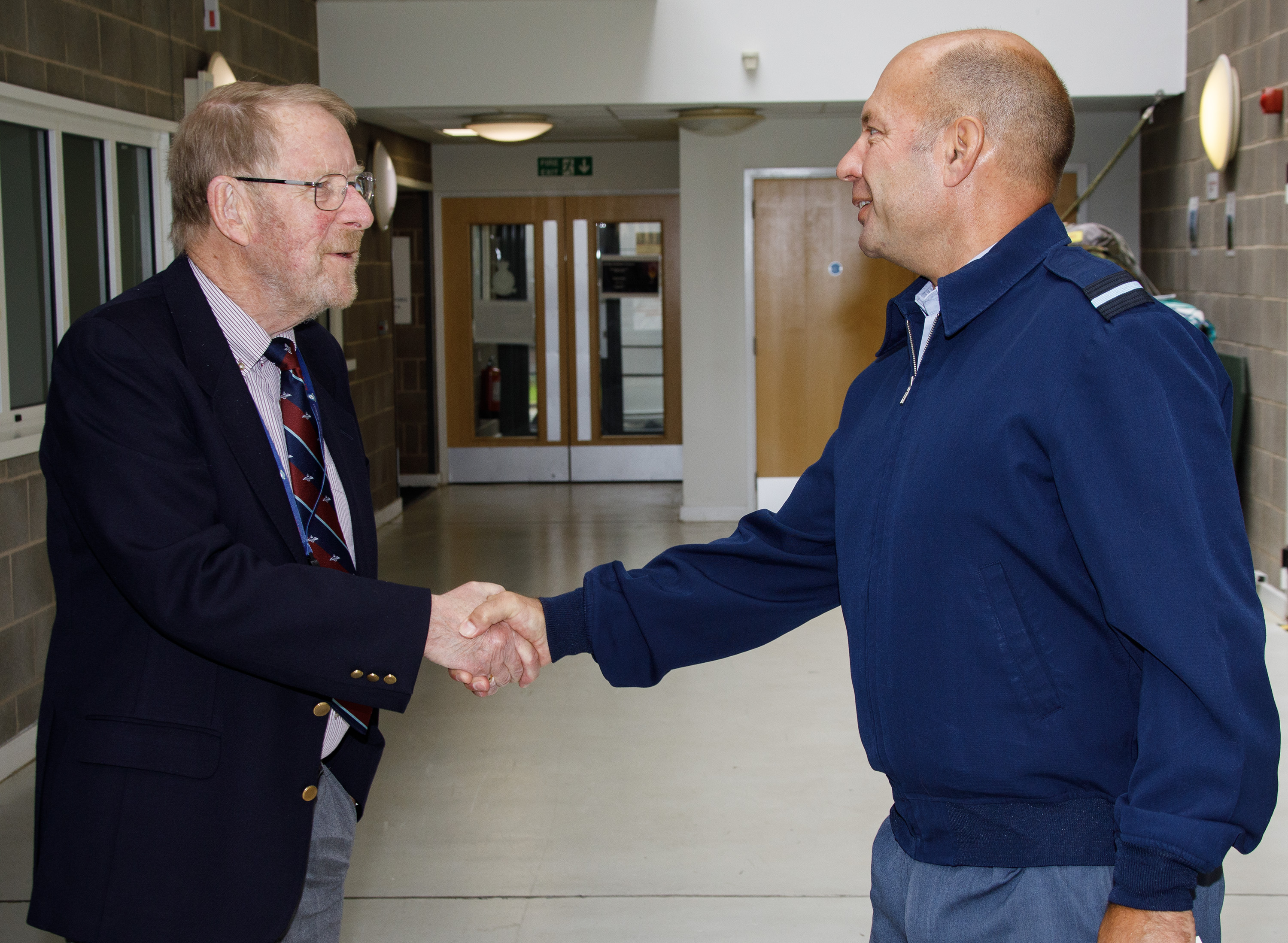 Photo - Air Commodore Dan James, Air Mobility Force Commander, shakes the hand of Squadron Leader Derek Oldham
